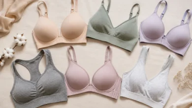Collection of comfortable bras and bralettes arranged on a soft beige background
