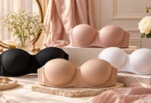 Collection of supportive strapless bras for large breasts in nude, black, blush and white, featuring molded cups and secure wide bands.
