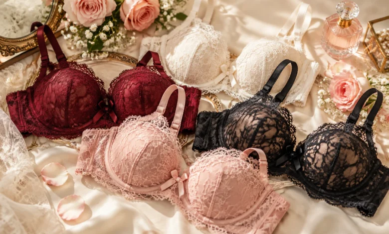 Elegant lacy bras collection featuring romantic floral lace designs arranged on luxurious satin fabric with soft rose accents.