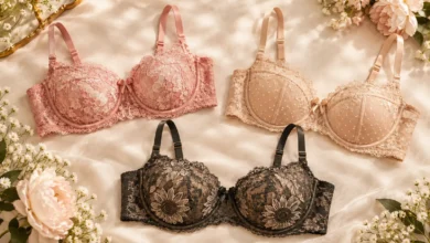 Old Navy women's lace balconette bra styles in pink floral lace, beige mesh-dot, and dark sunflower lace displayed on soft cream fabric with flowers.